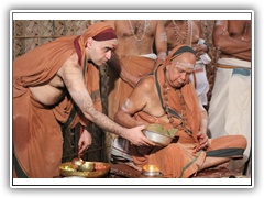 Their Holinesses performing Puja
