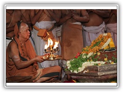 His Holiness performing Deeparadhana