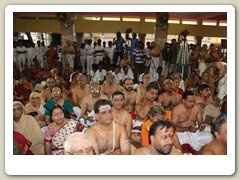 Devotees witnessing the Swarna Pada Puja