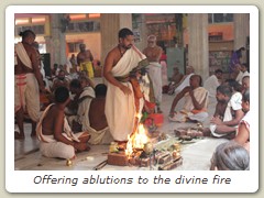 Offering ablutions to the divine fire