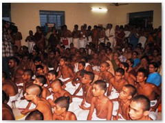 Patashala Vidyarthis and devotees participating in the Bhagavatgita recitation