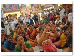 Devotees witnessing the puja